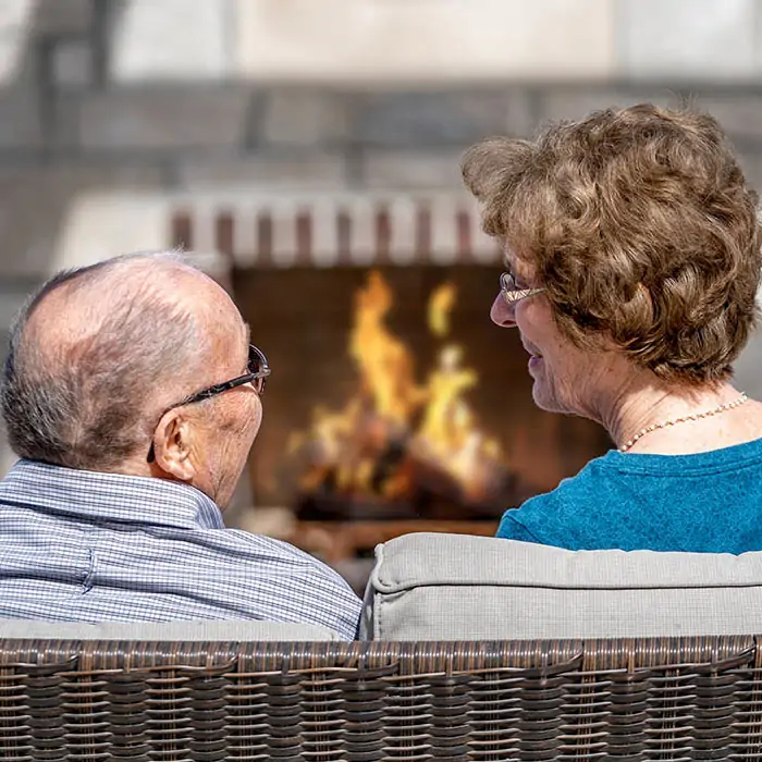 Couple in front of fireplace
