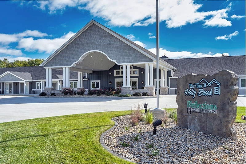 The Villas of Holly Brook & Reflections Memory Care entrance off West Dirksen Parkway, across from CEFCU, in Bellevue, IL.